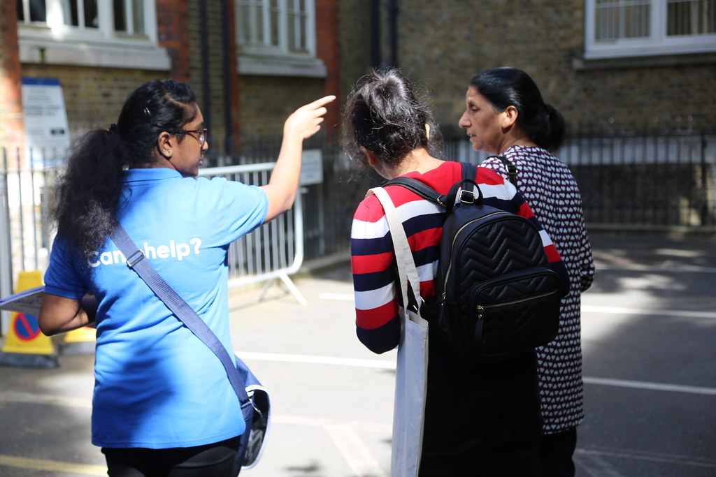 Student ambassador helping students with directions