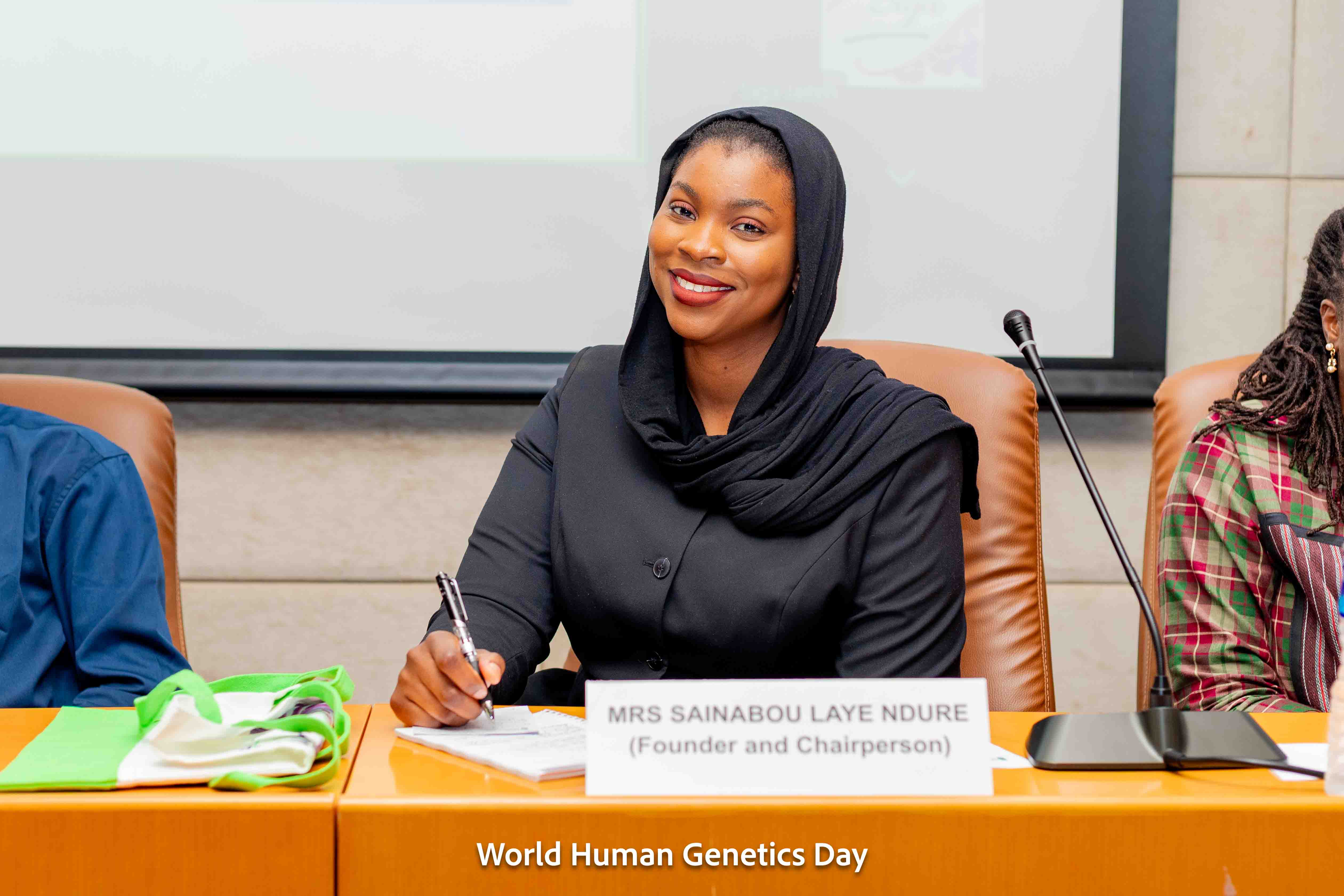 A photo of Sainabou Laye Ndure speaking at the inaugural World Human Genetics Day (WHGD) in March 2026