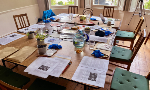 A table set up with materials for a gum diazo printmaking workshop