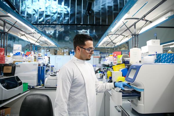 Scientist in white coat in a lab