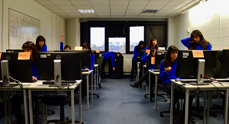 images of Raphaella in different positions around the computer lab