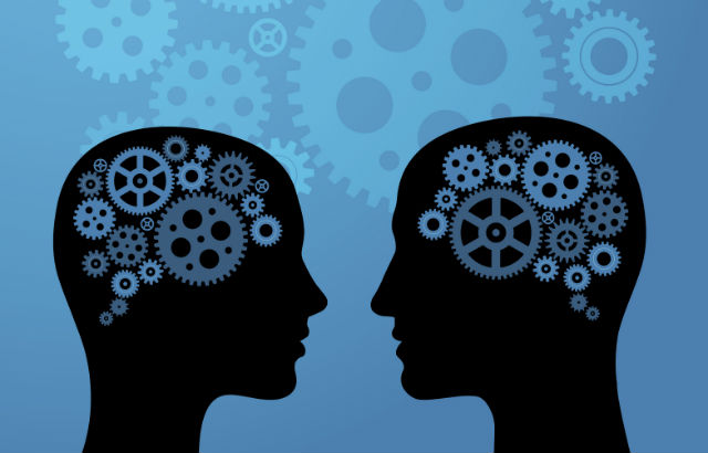 Two profiles facing each other with cog illustrations in their brain