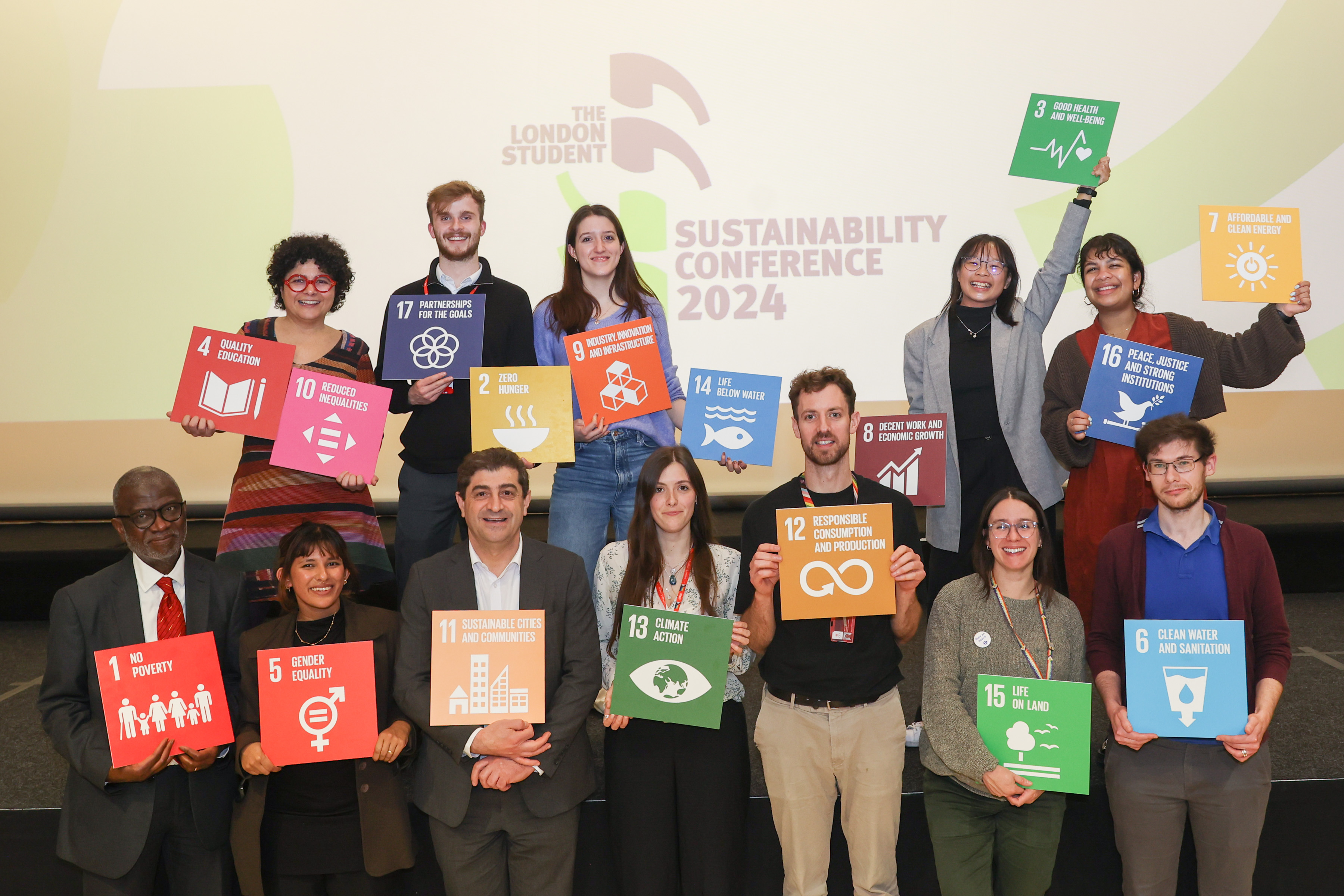 The staff who organised the London Student Sustainability Conference holding cards with each SDG written.