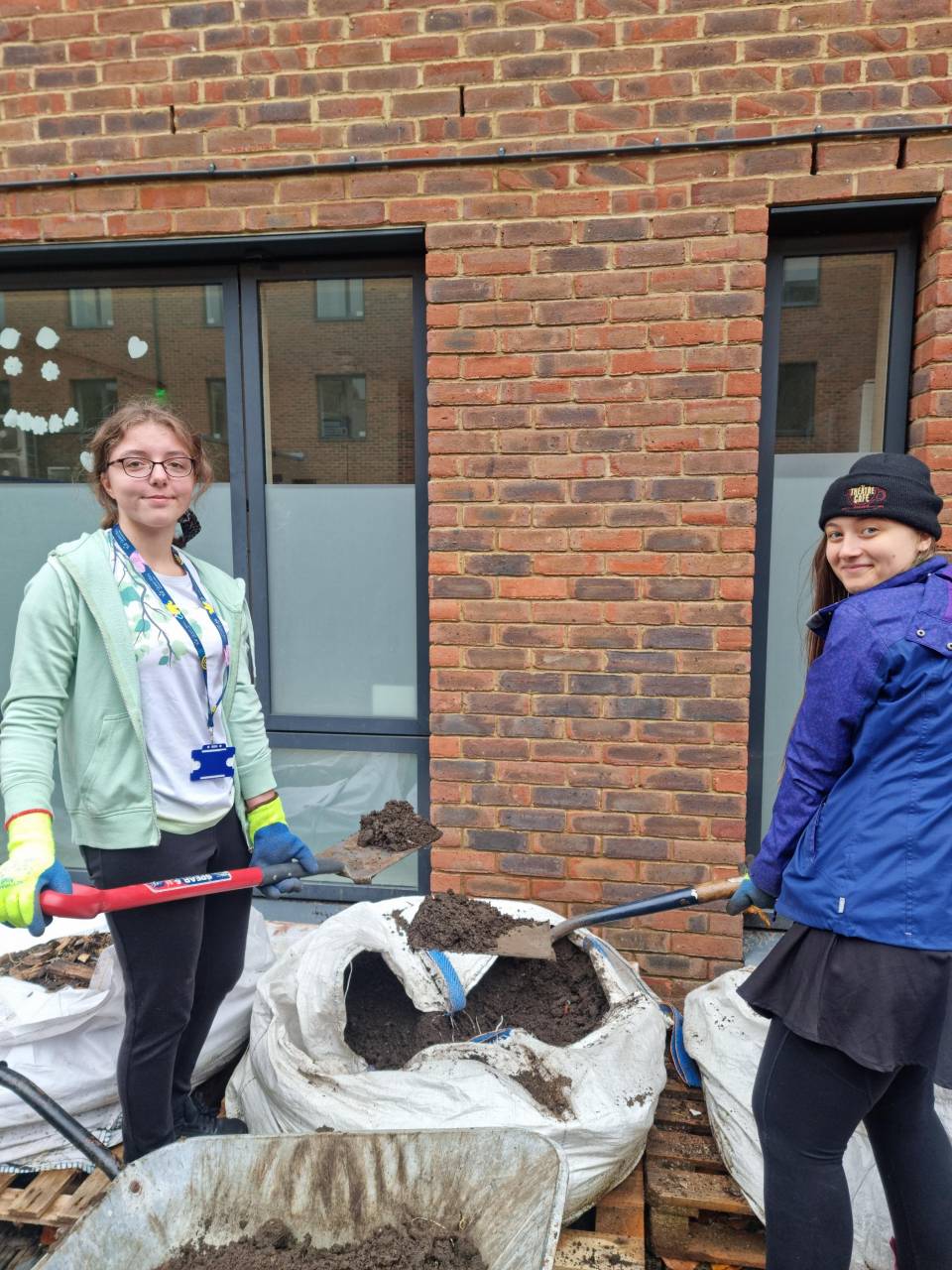Student volunteers refilling beds with soil at the campus allotments as part of Sustainability Week.
