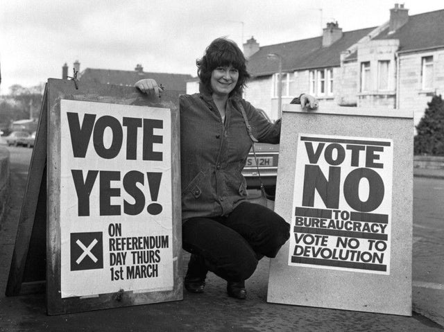 Photo of Scottish Woman Campaigner holding 'Vote Yes' and 'Vote No' signs in February 1979.