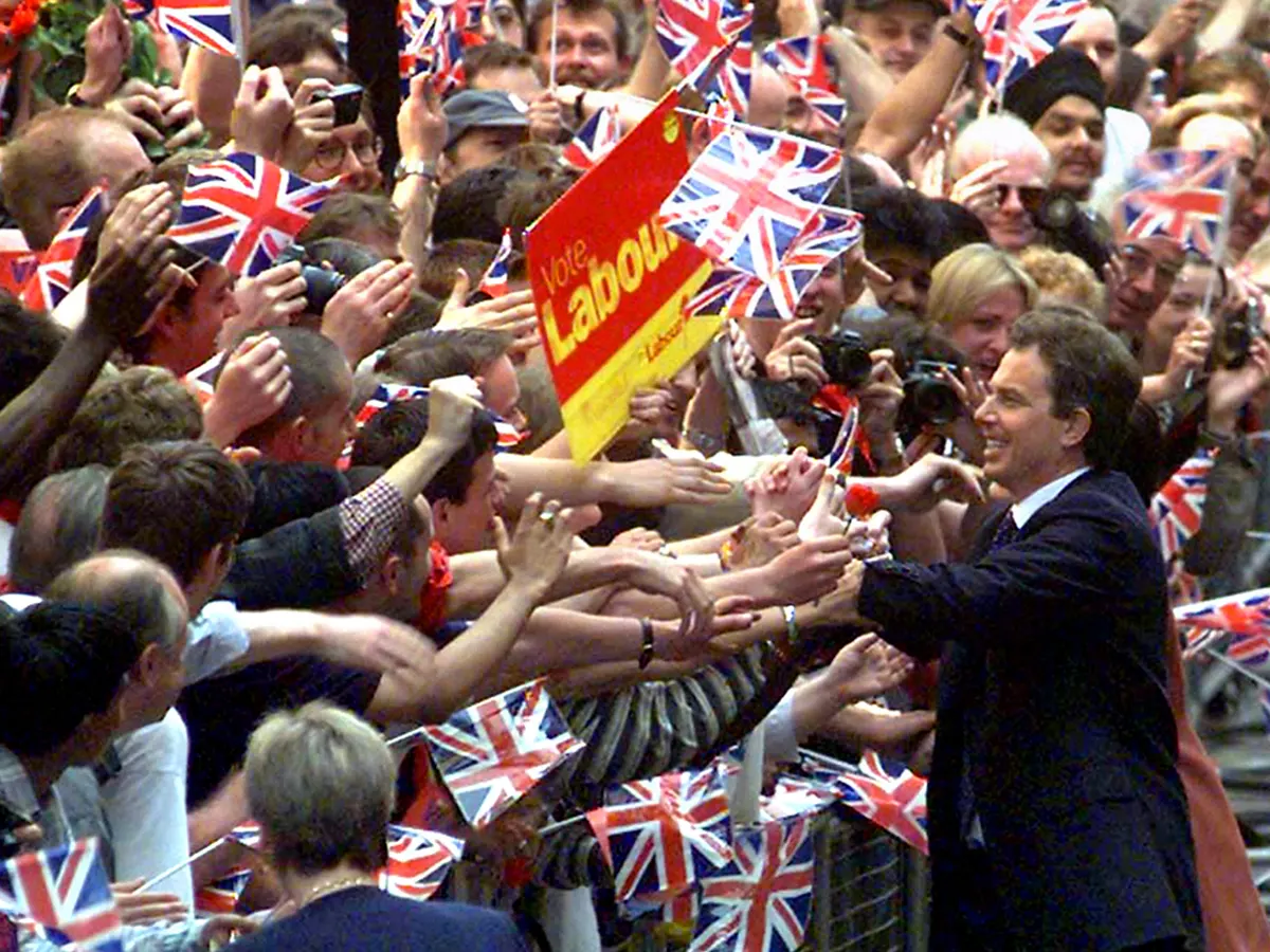 Photo of Tony Blair in Downing Street on 7 May 2022, thronged with New Labour supporters