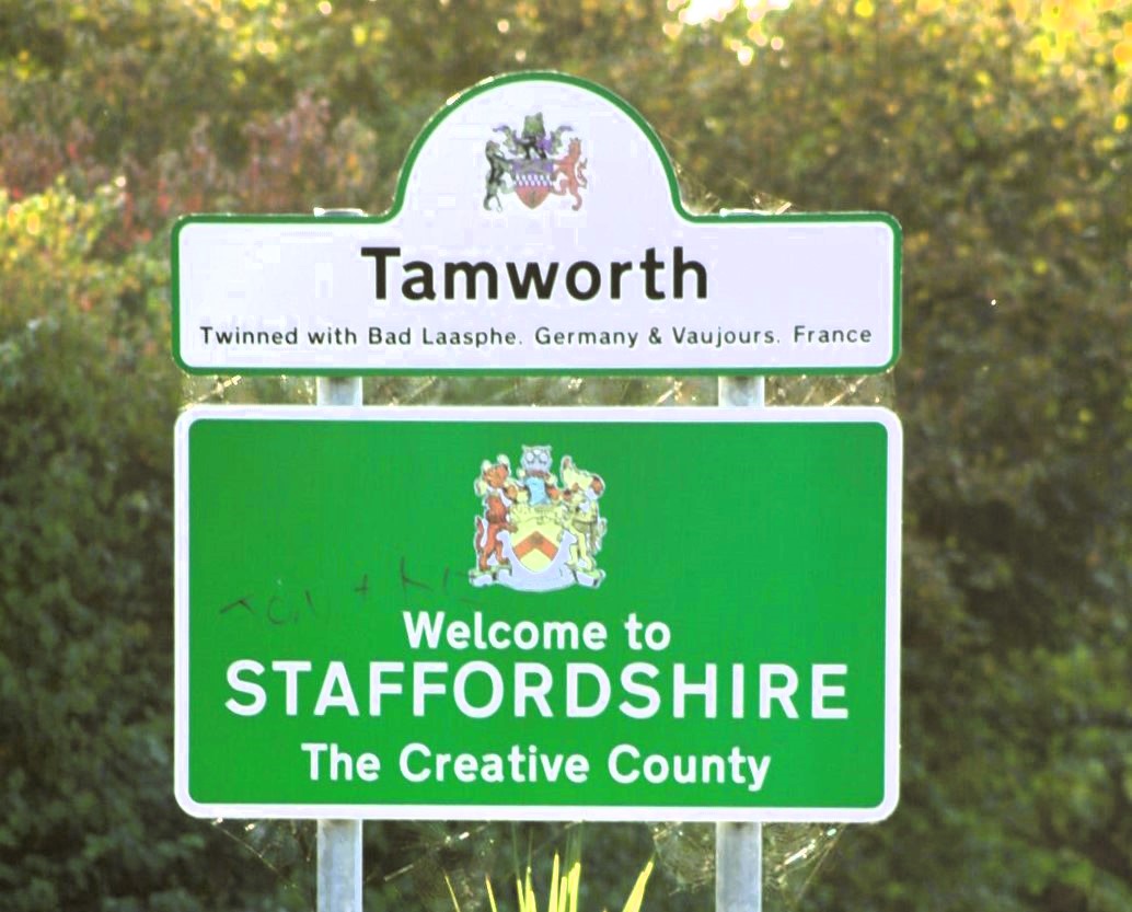 Tamworth town sign, above a Staffordshire sign for the 'Creative County'