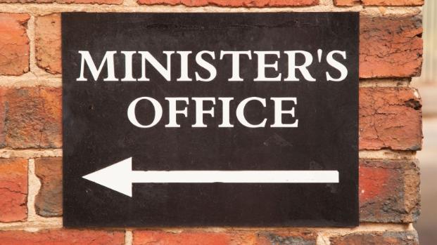 Photo of Sign with arrow saying Minister's Office.