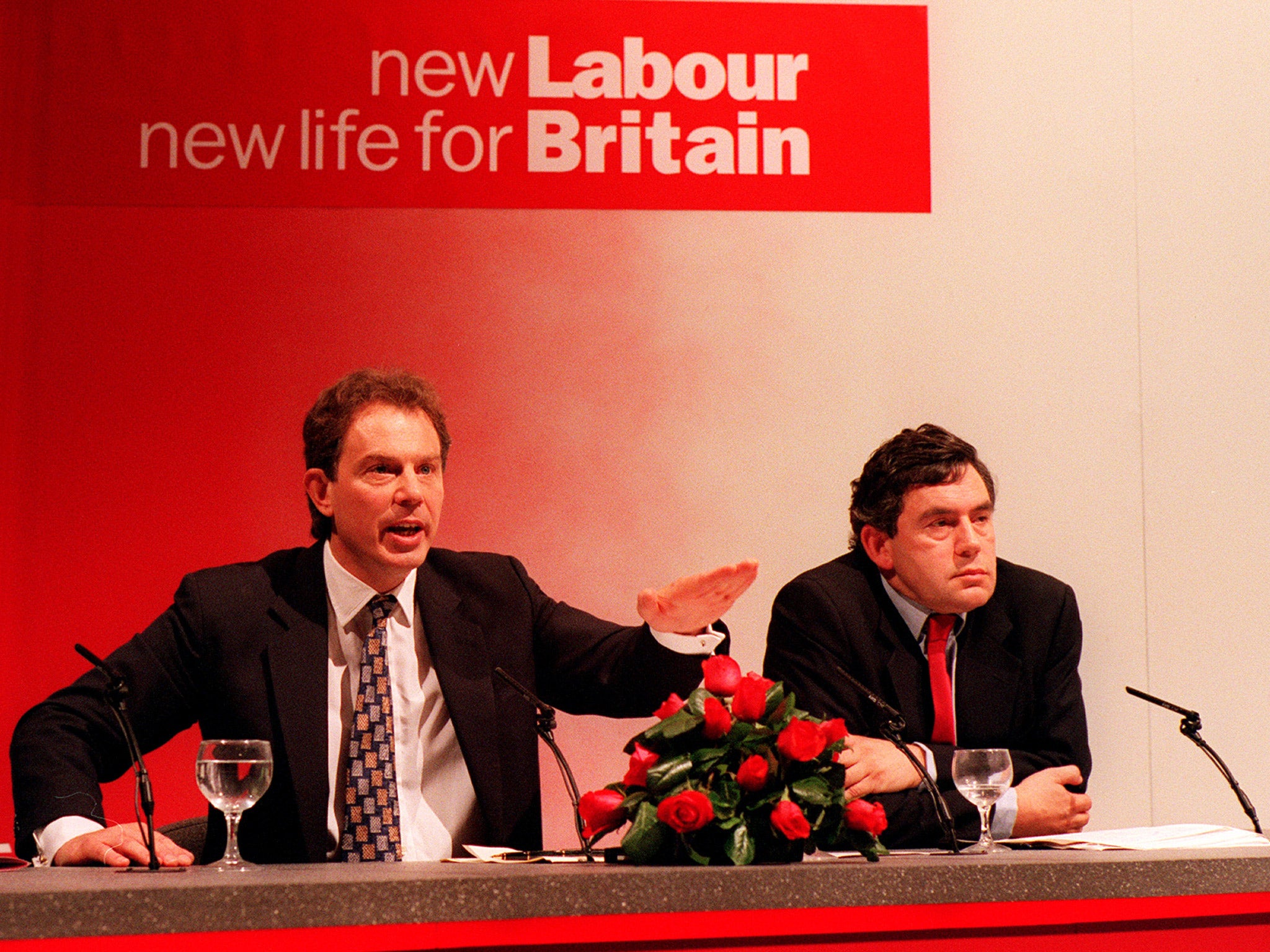 Photo of Tony Blair and Gordon Brown on a platform beneath a 'New Labour for a new Britain' banner