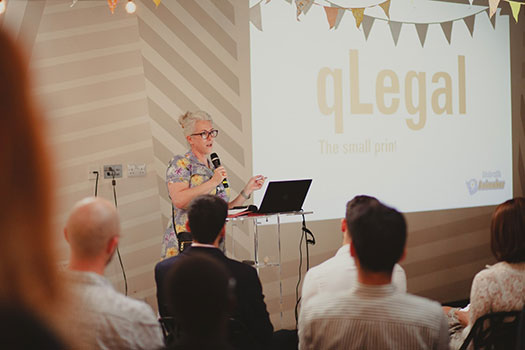 Karen Watton giving a speech at the qLegal summer party 2022