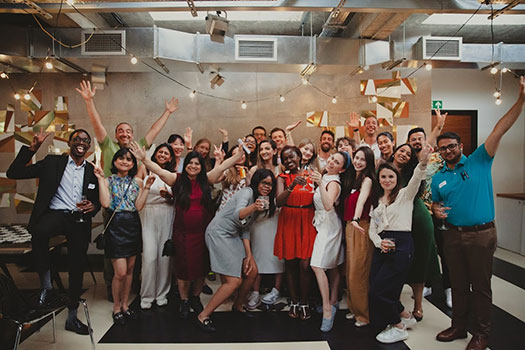 qLegal summer party attendees in a group photo