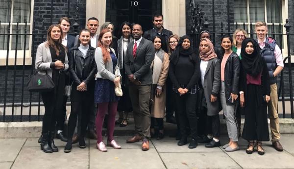 A group of Queen Mary BA Politics and International Relations students standing outside 10 Downing Street