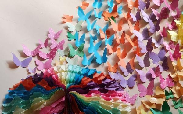 A paper collage of colourful butterflies made during the project