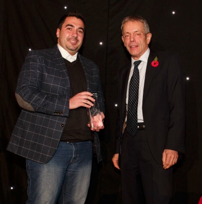 Dr Christophe Eizaguirre receiving his award from Principal Simon Gaskell