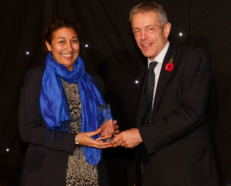 Dr Magda Osman receiving her award from Principal Simon Gaskell