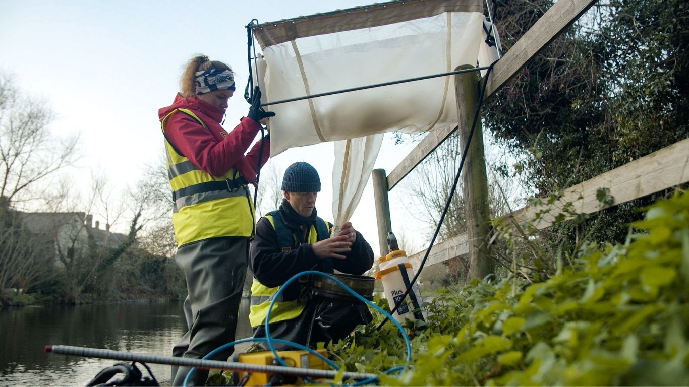 River Communities staff preparing microplastic sampling apparatus