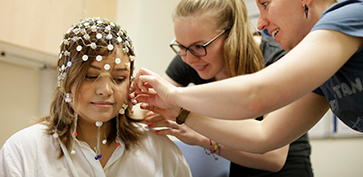 students using EEG equipment 
