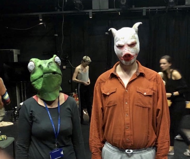 Two people wearing masks