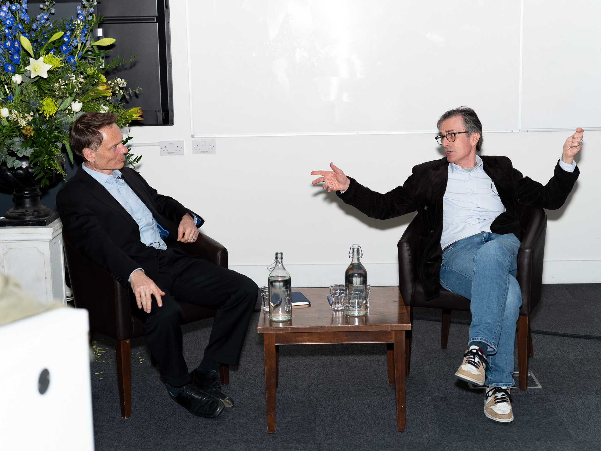 an image of Nicholas Bloom and Robert Peston in a Q&A