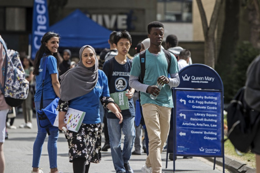 Female Student Ambassador and Two Male Prospective Students Walking on Campus