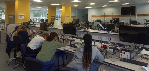 Students undertaking an experiment in the physics laboratory during the 2022 Girls into Physics summer school.
