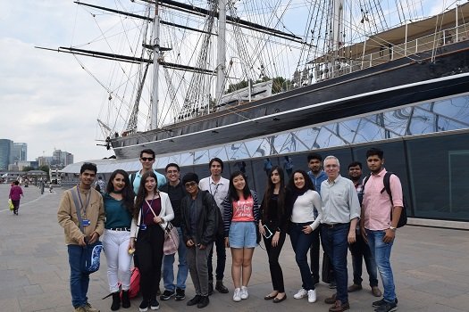 students on a field trip to the ship the Cutty Sark in Greenwich with their teacher during a class of the Queen Mary Summer School in London