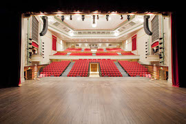 A view of the Great Hall at Quen Mary University of London from the rear of the stage 