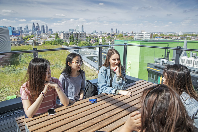 Students chatting on a rooftop