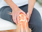 Image of man suffering with knee pain