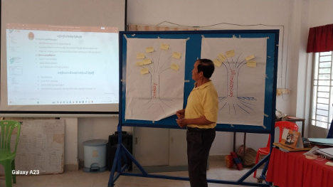 Teacher standing in front of a screen