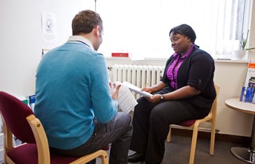 A service user gets support in a local healthcare setting.