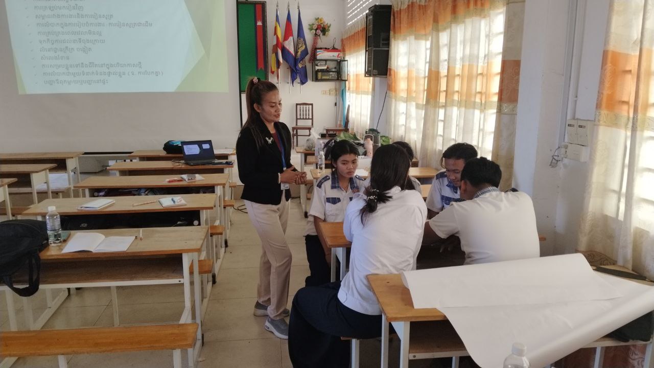 Students working in a classroom in a small group